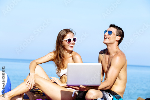 Couple on summer holidays vacation on tropical beach.