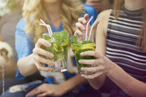 Sticker Close up of girls with drinks