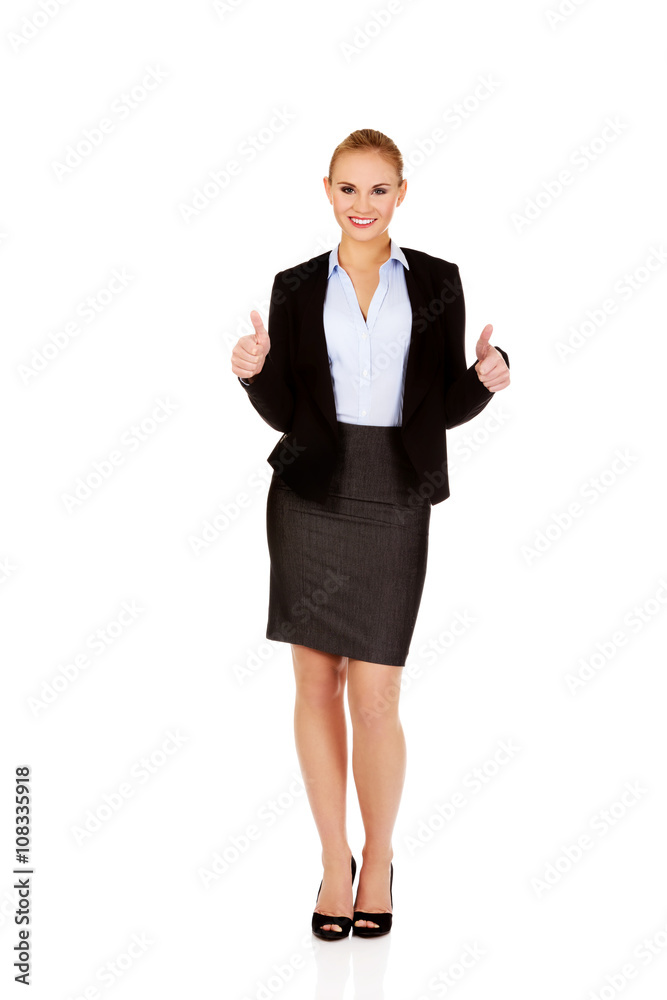 Young happy business woman with thumbs up Young happy business woman with thumbs up