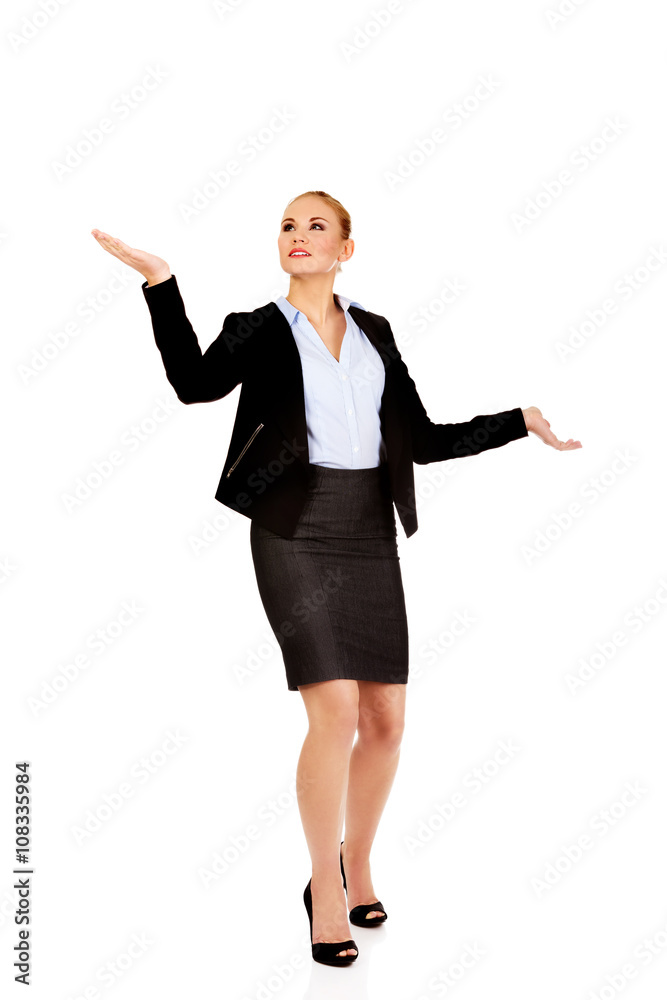 Young businesswoman trying to catch something Young businesswoman trying to catch something