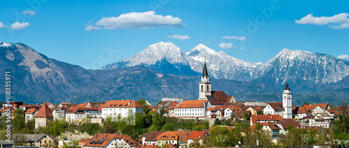Panorama of Kranj, Slovenia, Europe. Kranj in Slovenia with St. Cantianus Church in the foreground and the Kamnik Alps behind photo