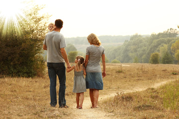 young family on the nature