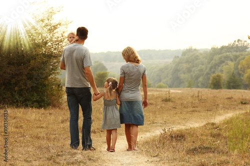 young family on the nature