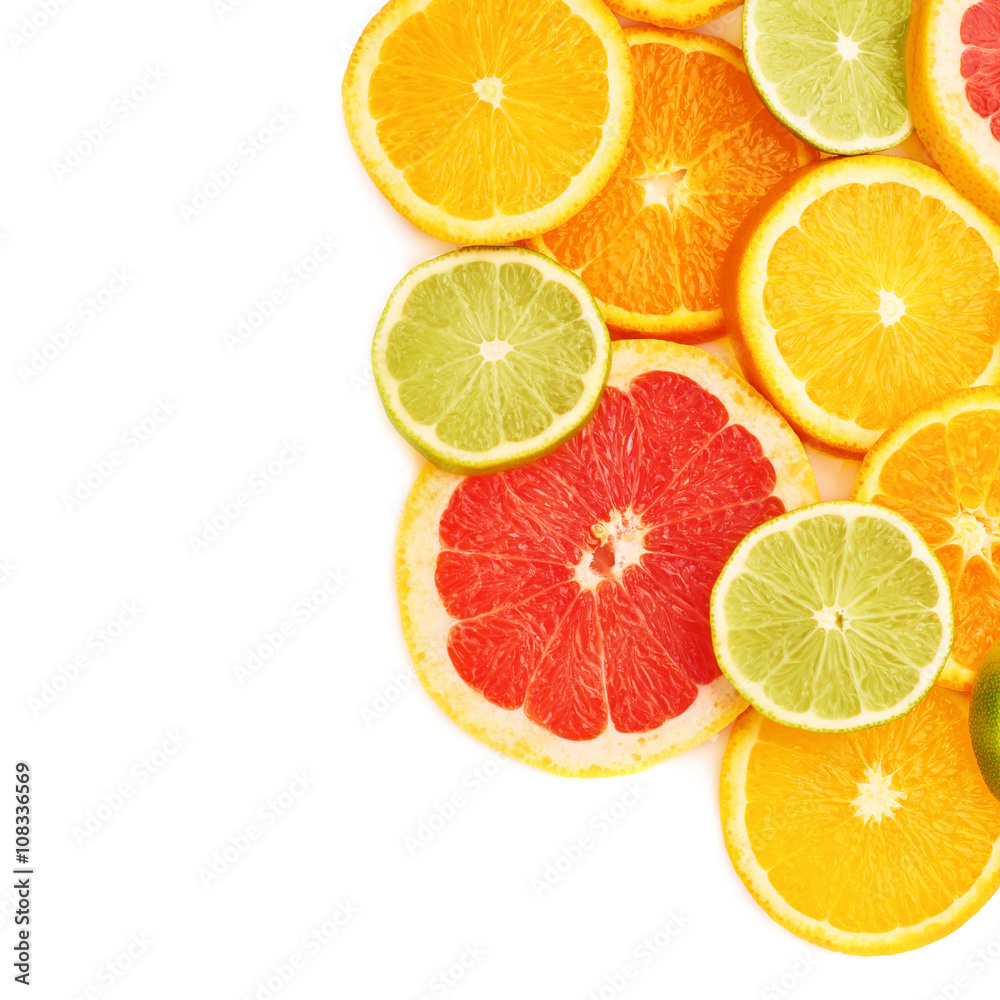 Surface covered with citrus sliced fruits over white isolated background Surface covered with citrus sliced fruits over white isolated background