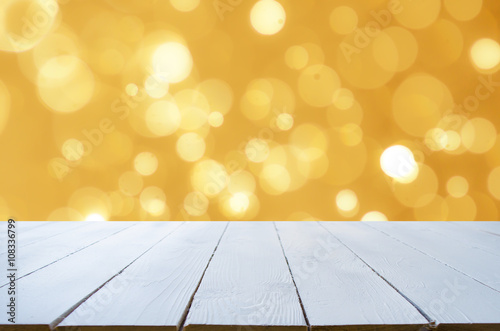 Gold abstract backgrounds with bokeh. And table top can put or montage your products for display.