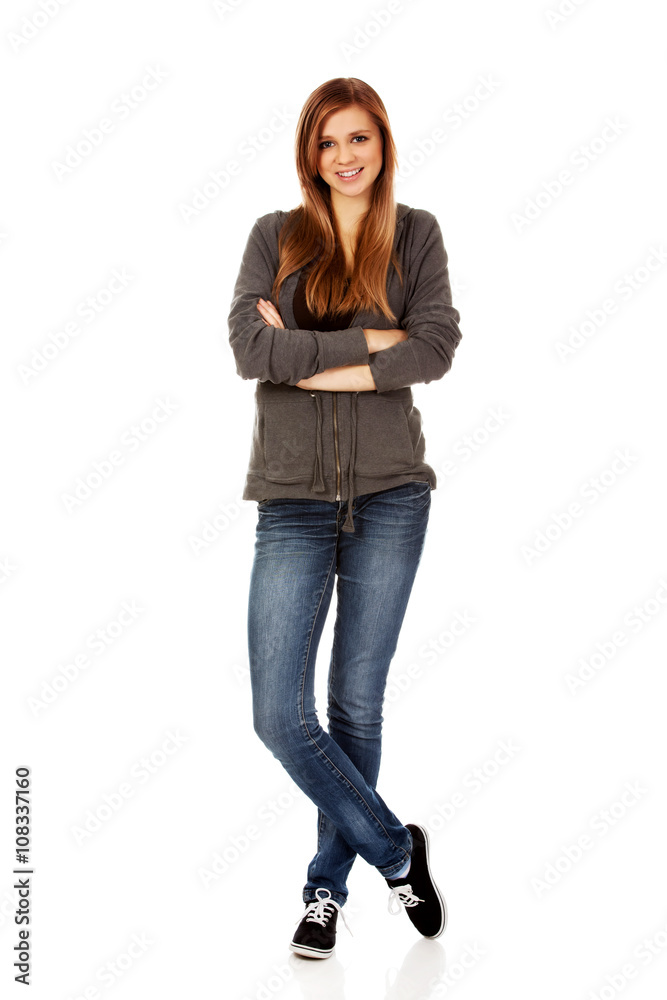 Happy teen woman with folded arms Happy teen woman with folded arms