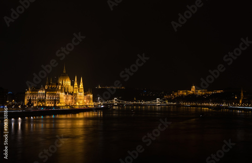 View of Hungarian Parliament Building, Royal Palace and Danube  river from Margit bridge at night. © sonyakamoz