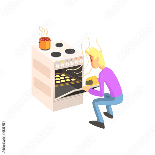 Guy Taking Out Cookies From Oven