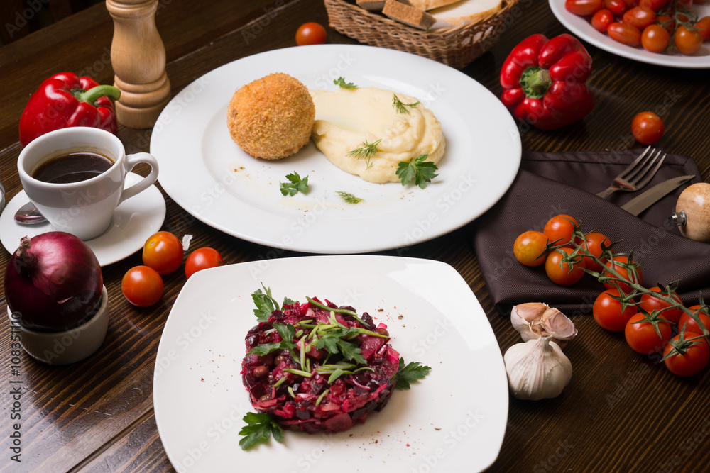 Meat in Breadcrumbs, Salad And Cup of Coffee On A Table Meat in Breadcrumbs, Salad And Cup of Coffee On A Table