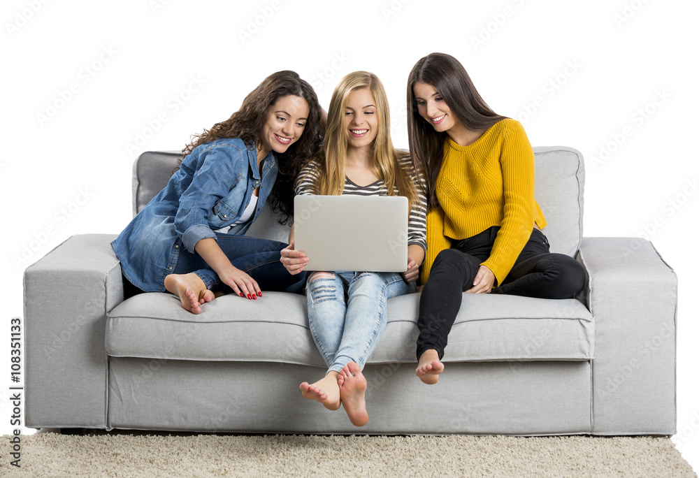 Teenage girls using a laptop Teenage girls using a laptop