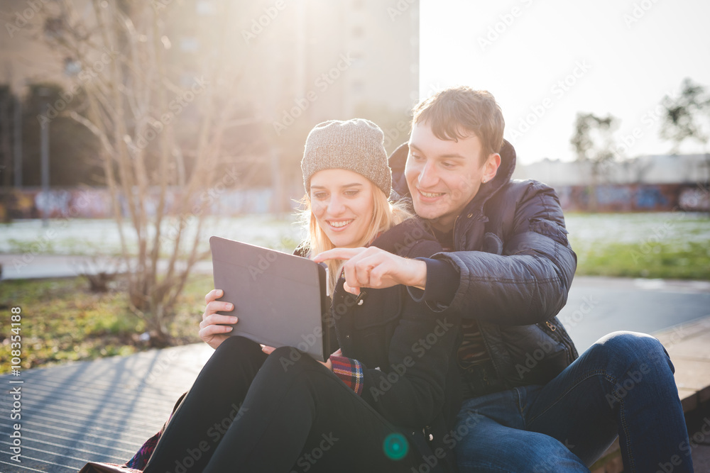 young couple lovers authentic using tablet