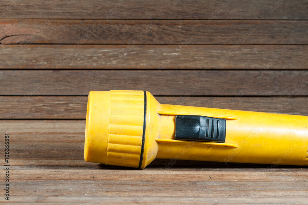 Flashlight on wooden texture. Flashlight on wooden texture.