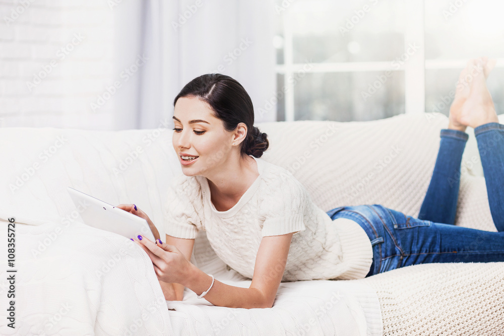 Beautiful woman using digital tablet at home Beautiful woman using digital tablet at home