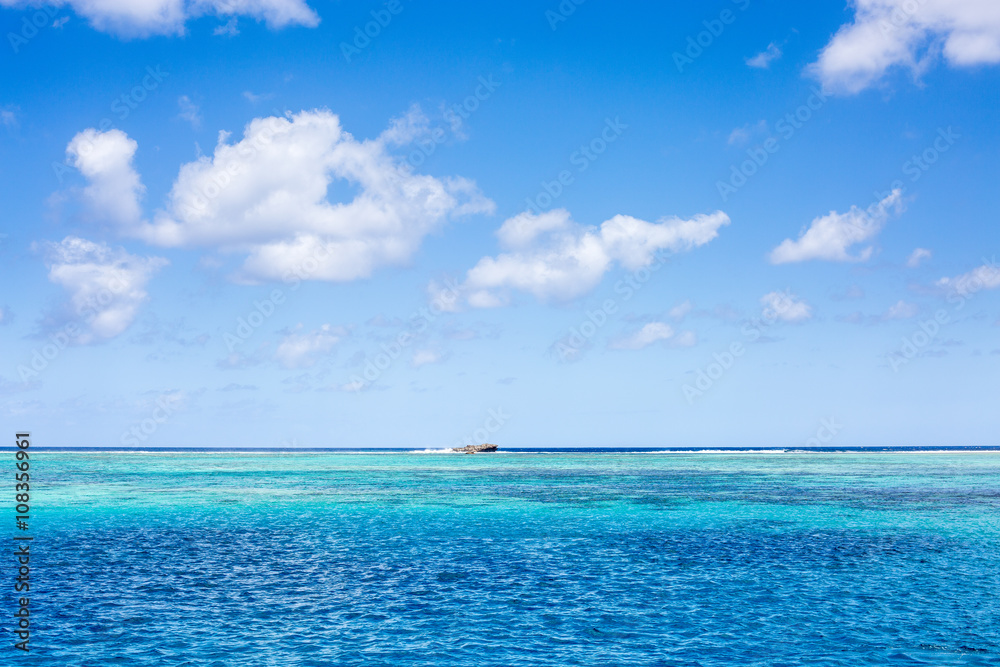 Crystal turquoise blue sea in a tropical beach on sunny day. Transparent sea water. Sunny day sea background.