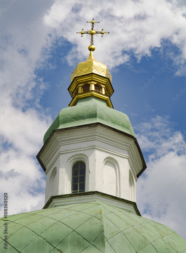Golden dome of the Orthodox church on the blue sky background 