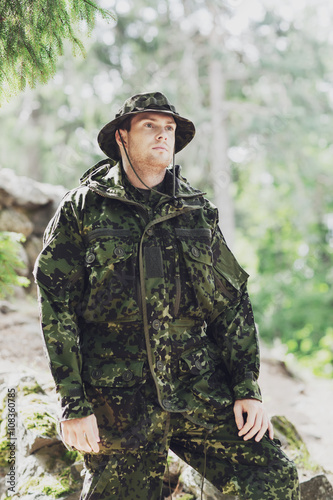 young soldier or ranger in forest