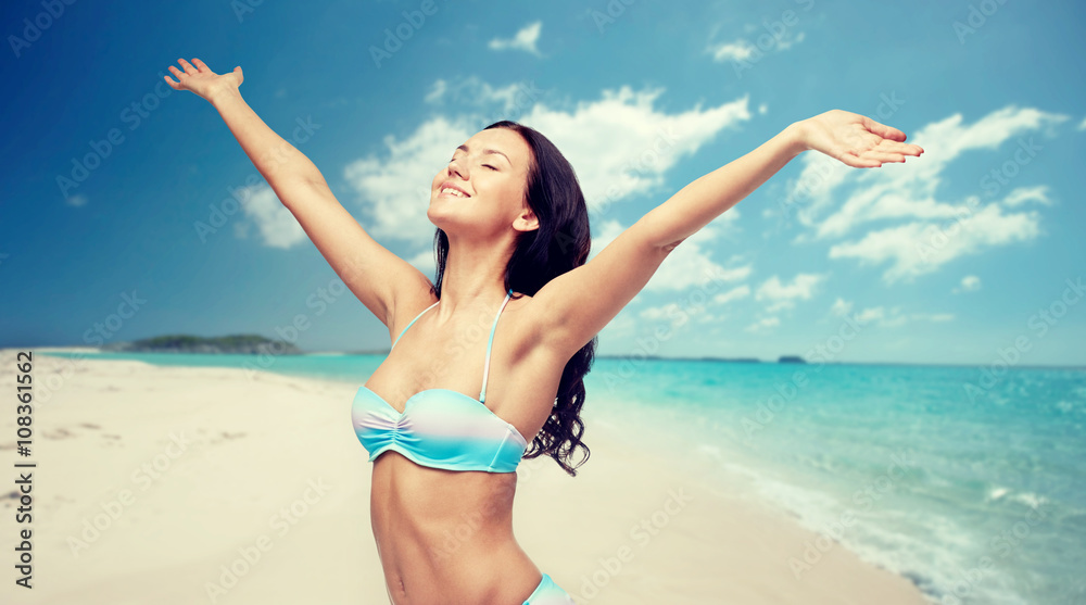 happy woman in bikini swimsuit with raised hands happy woman in bikini swimsuit with raised hands