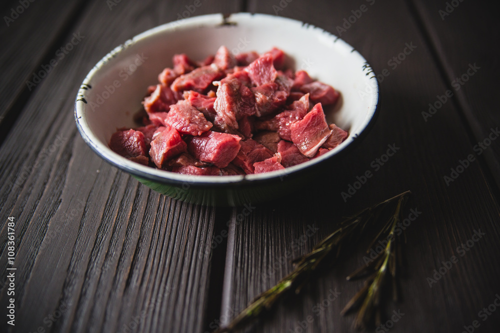minced meat on wooden table minced meat on wooden table