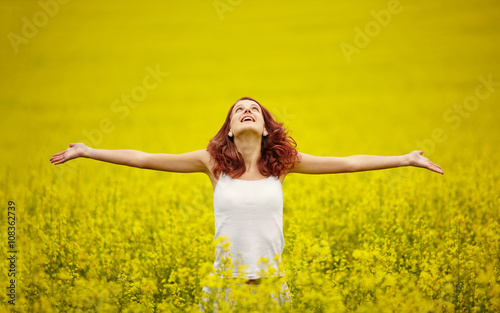 young beautiful girl in yellow field © Aliaksei Lasevich