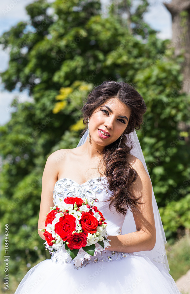 Beautiful wedding bouquet in hands of the bride Beautiful wedding bouquet in hands of the bride