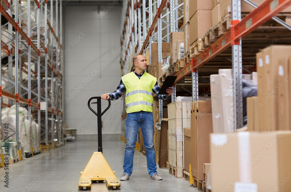 man with loader and clipboard at warehouse man with loader and clipboard at warehouse