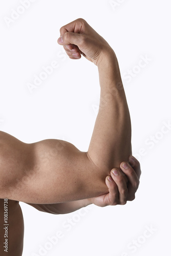 muscular body man holding elbow sore in pain in body health care and sport medicine