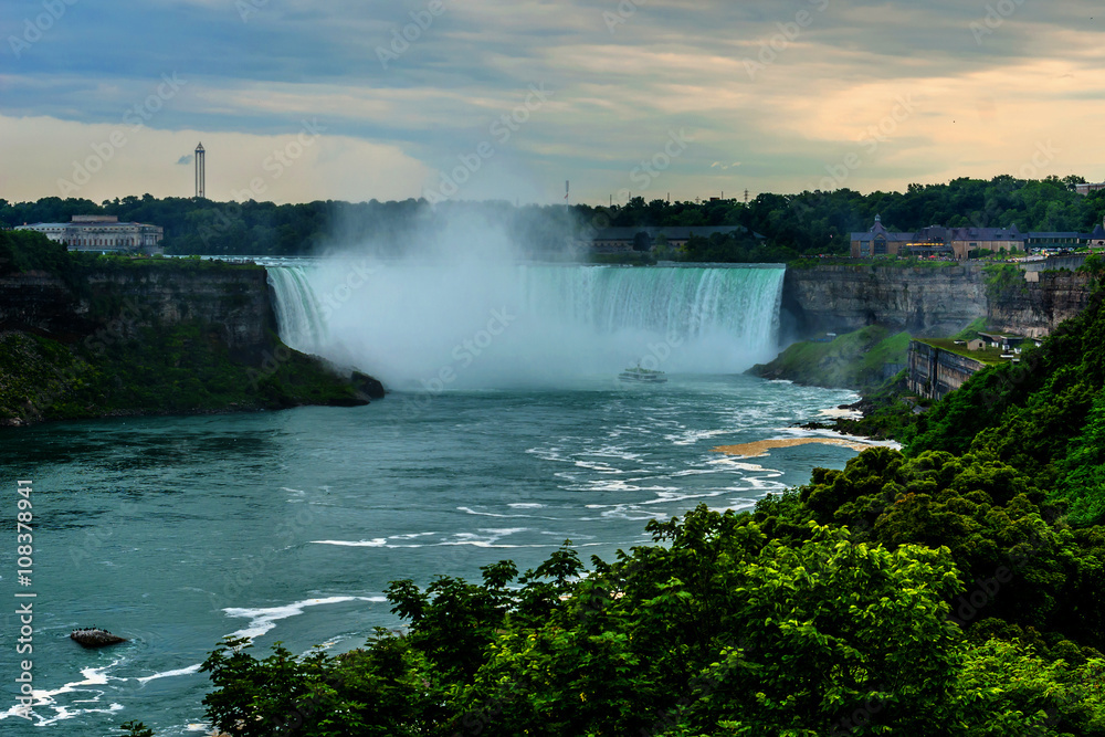 Niagara Falls closeup panorama at evening. Ontario, Canada. Niagara Falls closeup panorama at evening. Ontario, Canada.