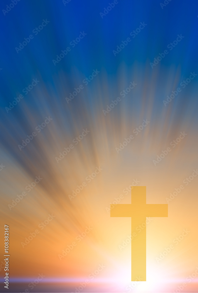Cross of hope and faith in God and in the background rays of sun