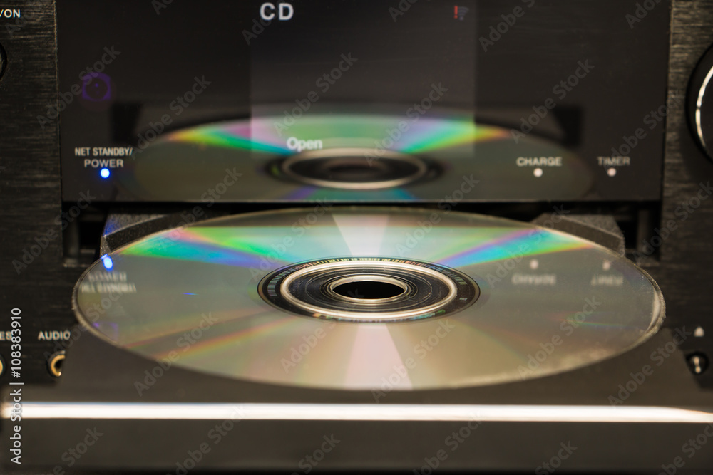 Selective focus cd and its reflection on the surface of a cd player Selective focus cd and its reflection on the surface of a cd player