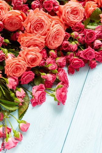 Roses on wooden background