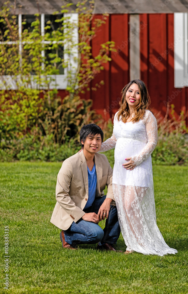 Expecting mom and dad enjoying the day outdoors Expecting mom and dad enjoying the day outdoors