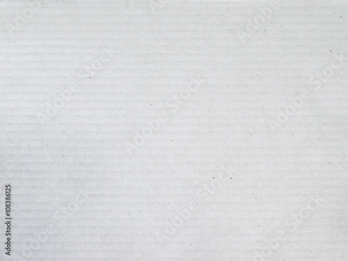 Texture of waved cardboard. Bright monochrome paper.
