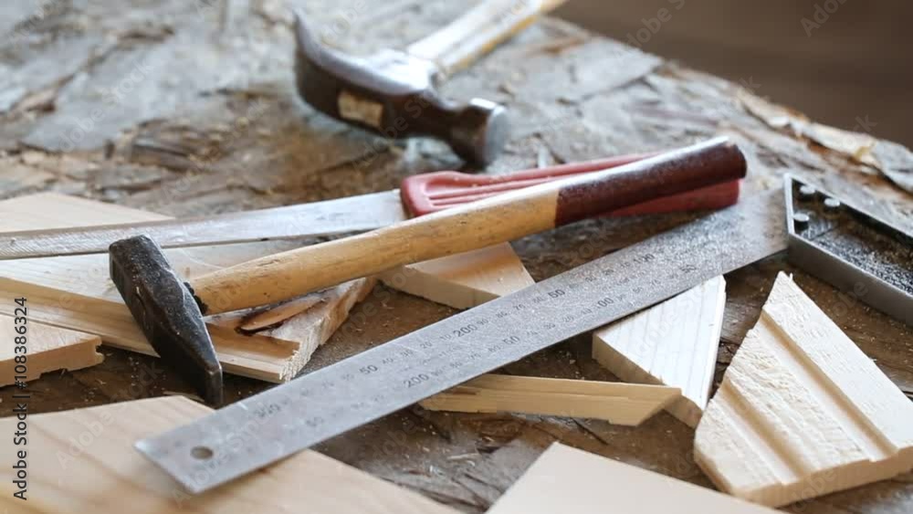 Hammer, knife, ruler and tongue and groove boards on working place, closeup
Hammer, knife, ruler and tongue and groove boards on working place, closeup