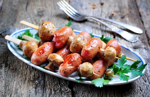 Grilled mushrooms on skewers with sausages