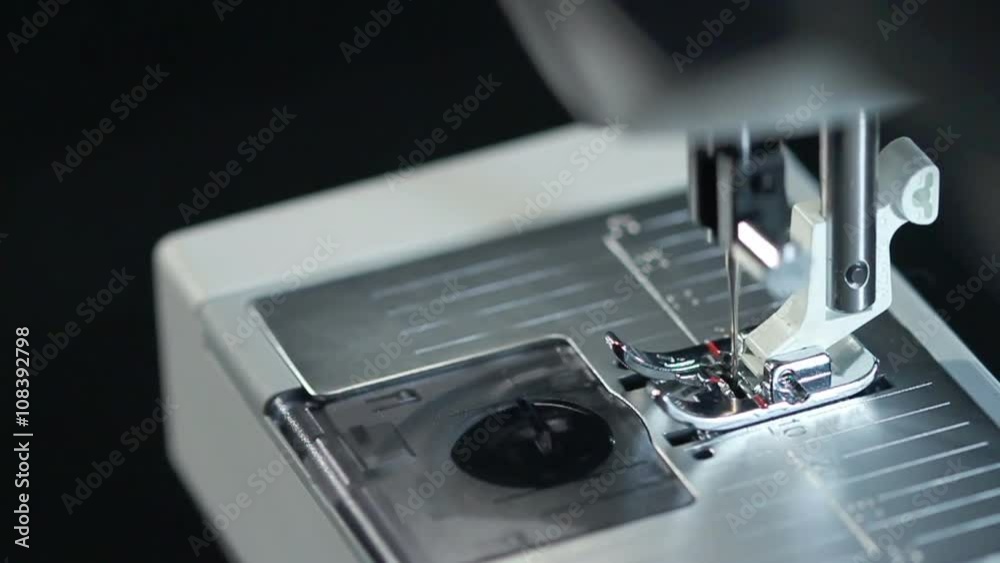 Sewing needle in slow motion. Top view of working sewing machine in