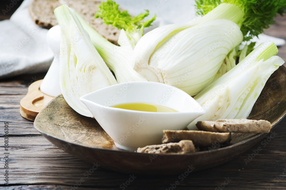 Fresh sweet fennel on the wooden table Fresh sweet fennel on the wooden table