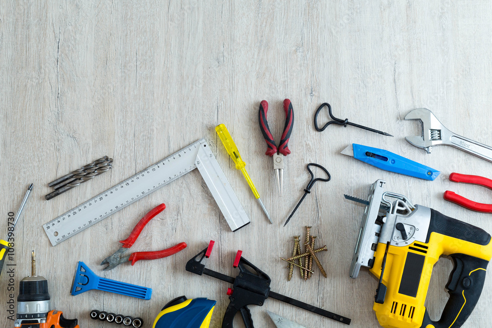 Different tools on a wooden background with the place for inscri Different tools on a wooden background with the place for inscri