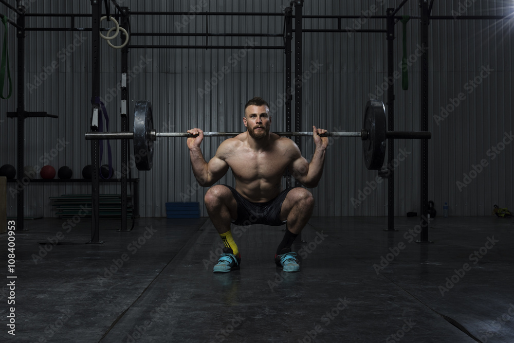 Bodybuilder working out at the gym Bodybuilder working out at the gym