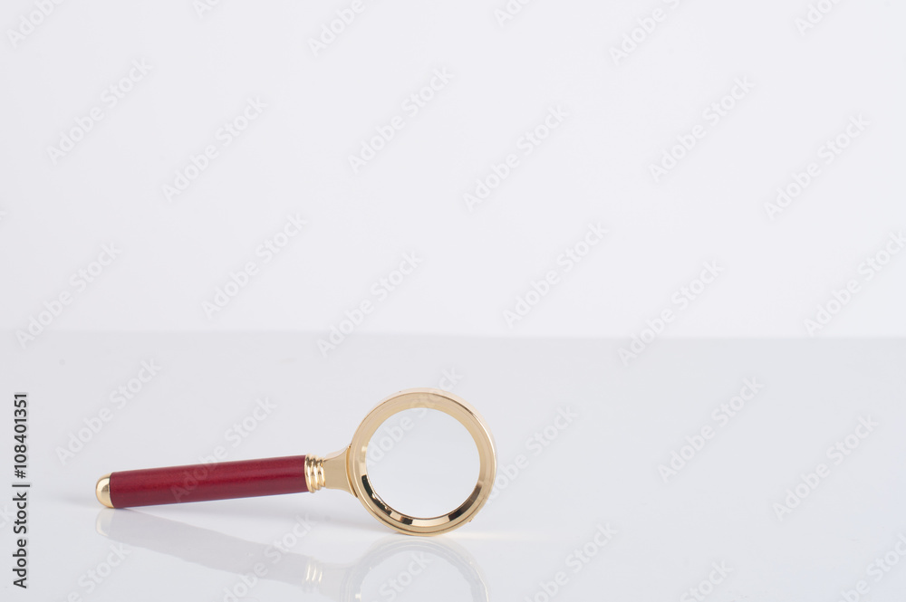 magnifying glass on white screen