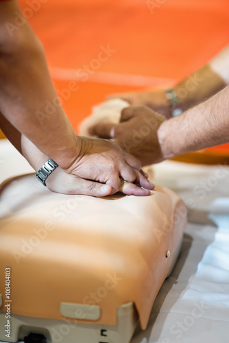 CPR training with dummy doll © Microgen