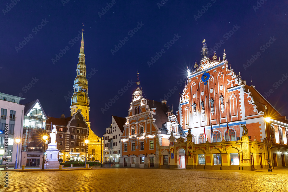 City Hall Square with House of the Blackheads and Saint Peter church in Old Town of Riga at night, Latvia