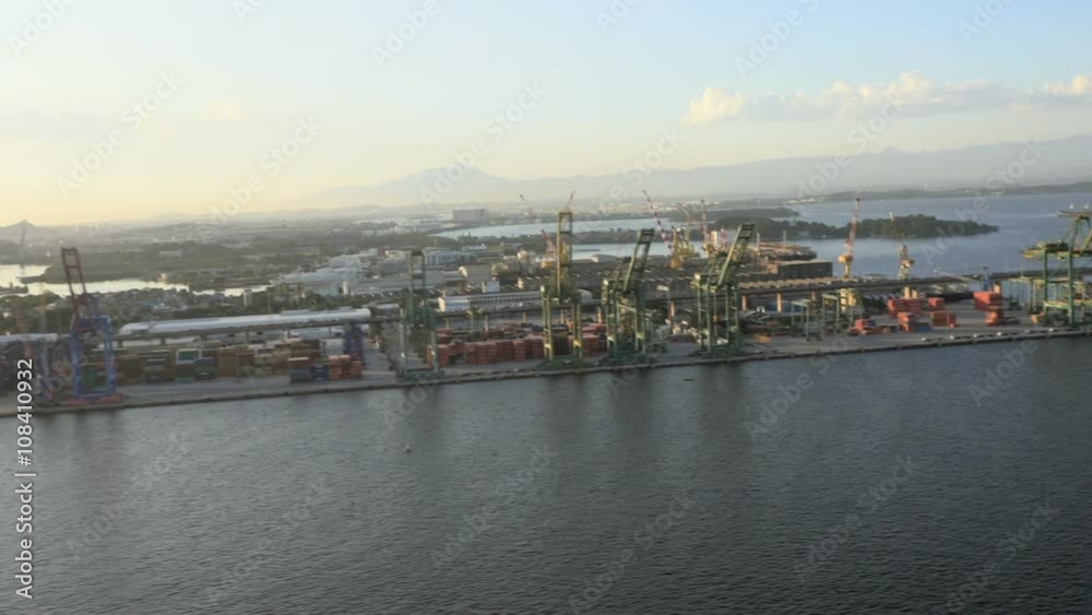 Flying along industrial area with cranes by the ocean, Rio de Janeiro, Brazil Flying along industrial area with cranes by the ocean, Rio de Janeiro, Brazil