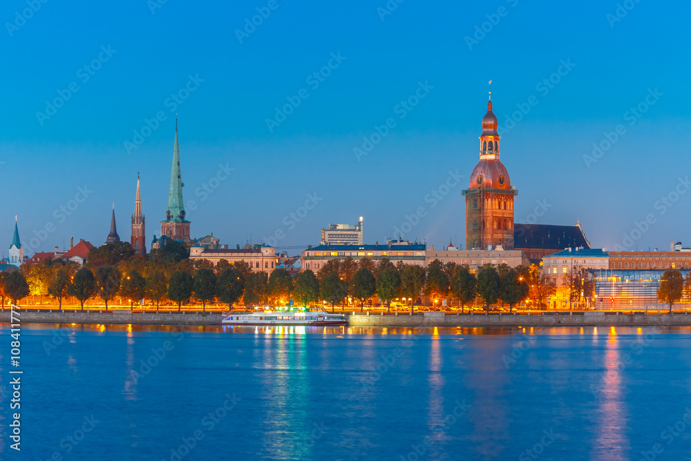 Old Town of Riga and River Daugava at night, Riga Cathedral, Cathedral Basilica of Saint James and Riga castle in the background, Latvia