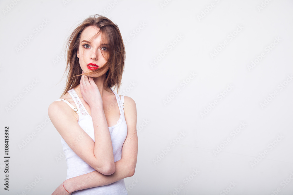 Sensual young woman with beautiful long brown hairs, posing isolated on white Sensual young woman with beautiful long brown hairs, posing isolated on white