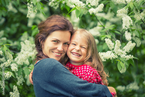 Outdoor portrait of mother and daughter