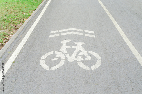 Bicycle lane sign on the road in public park