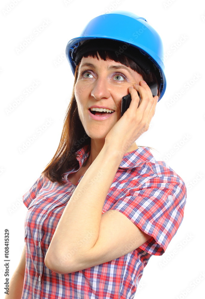 Builder woman in protective helmet talking on mobile phone Builder woman in protective helmet talking on mobile phone
