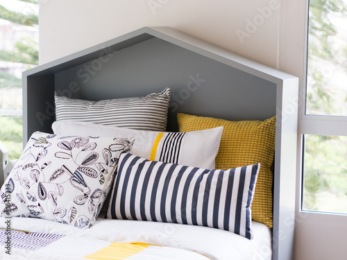 modern pillows on bed