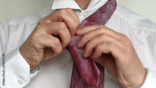 man tying tie 1
