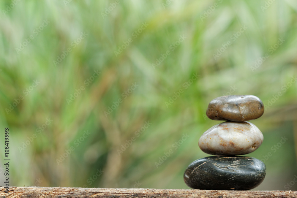Tower stone with bamboo in the background. Concept of tranquility,peace and relaxing. Tower stone with bamboo in the background. Concept of tranquility,peace and relaxing.